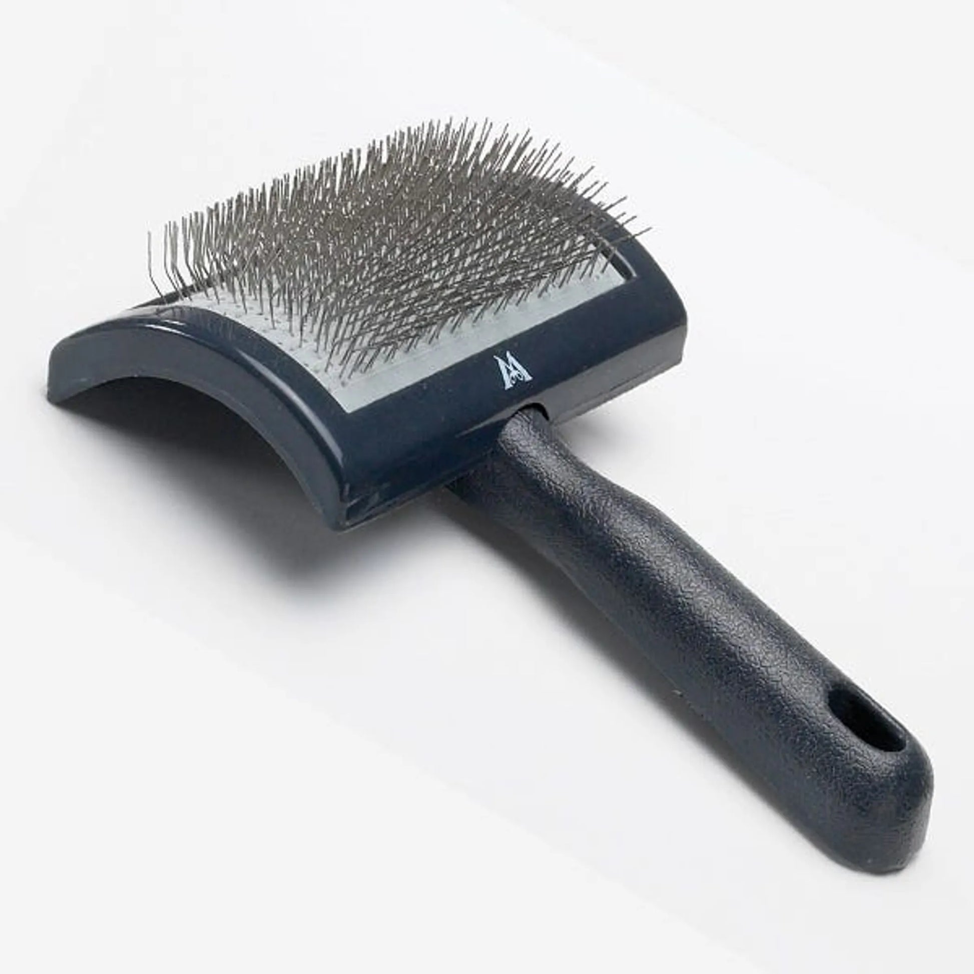 Pet grooming brush with bristles on a white background