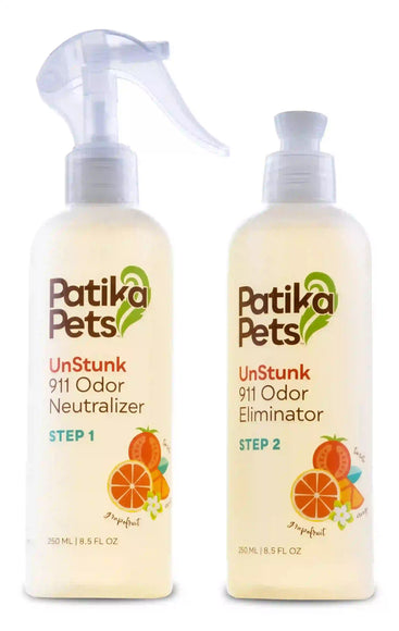 Two spray bottles of Patika Pets UnStunk 911 Odor Neutralizer, one labeled as Step 1 and one as Step 2, in white and orange design with Citrus illustrations.