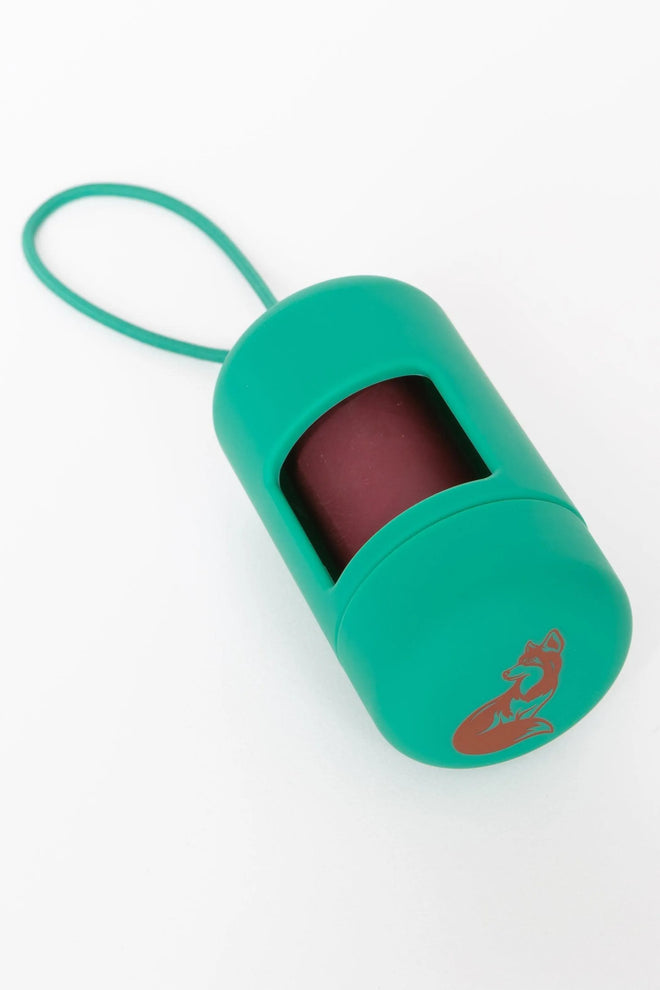 A green Fresh Peppermint Waste Bag Dispenser attached to a teal leash, designed to hold dog waste bags.