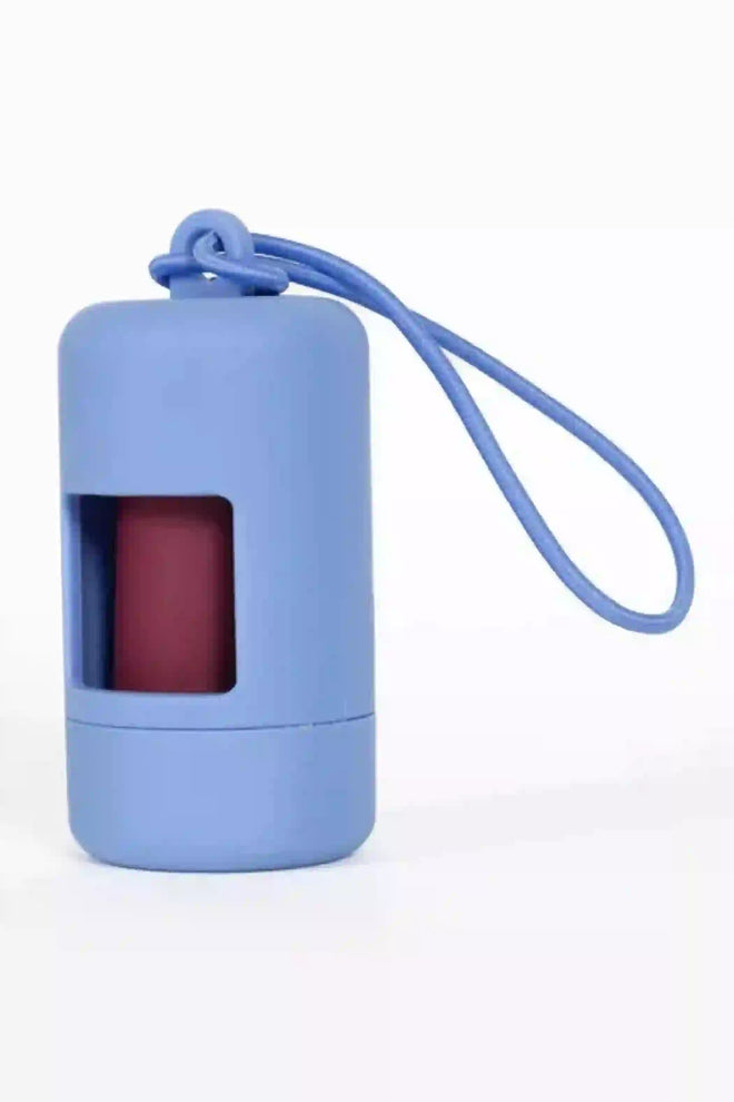 A cornflower blue dog waste bag dispenser with a transparent window and a blue bungee cord attached to it.