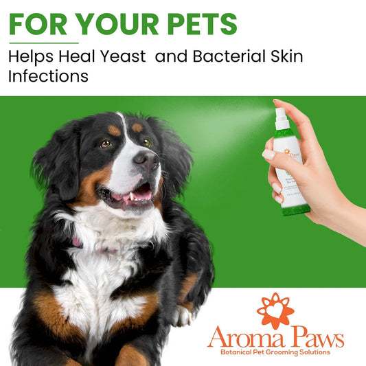 Dog with a spray bottle labeled 'Aroma Paws' on a green background