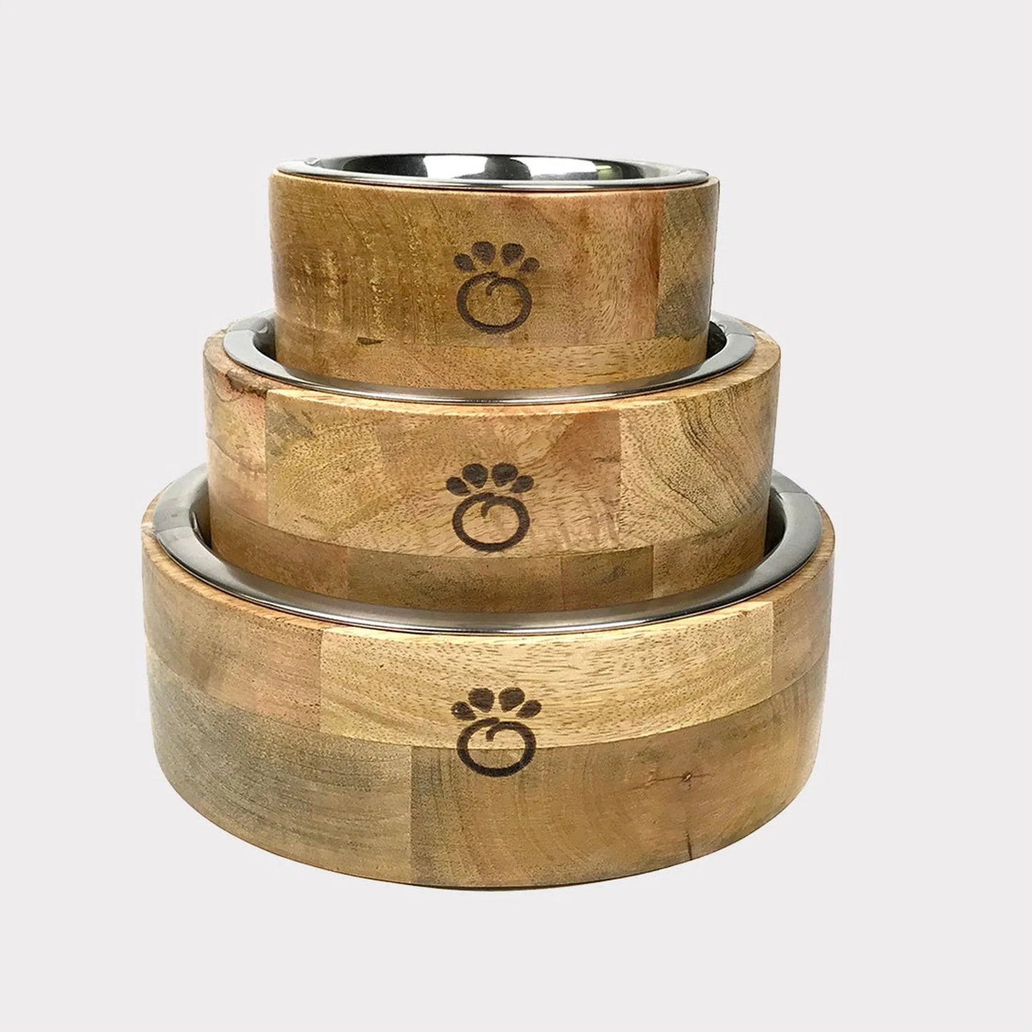 Set of three wooden pet bowls with metal rims on a light gray background