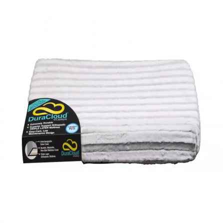DuraCloud Orthopedic Pet Bed and Crate Pad in white, packaged rolled with branding label on top.