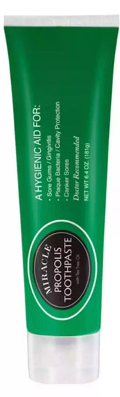 Green tube of Miracle Propolis Toothpaste with Tea Tree Oil